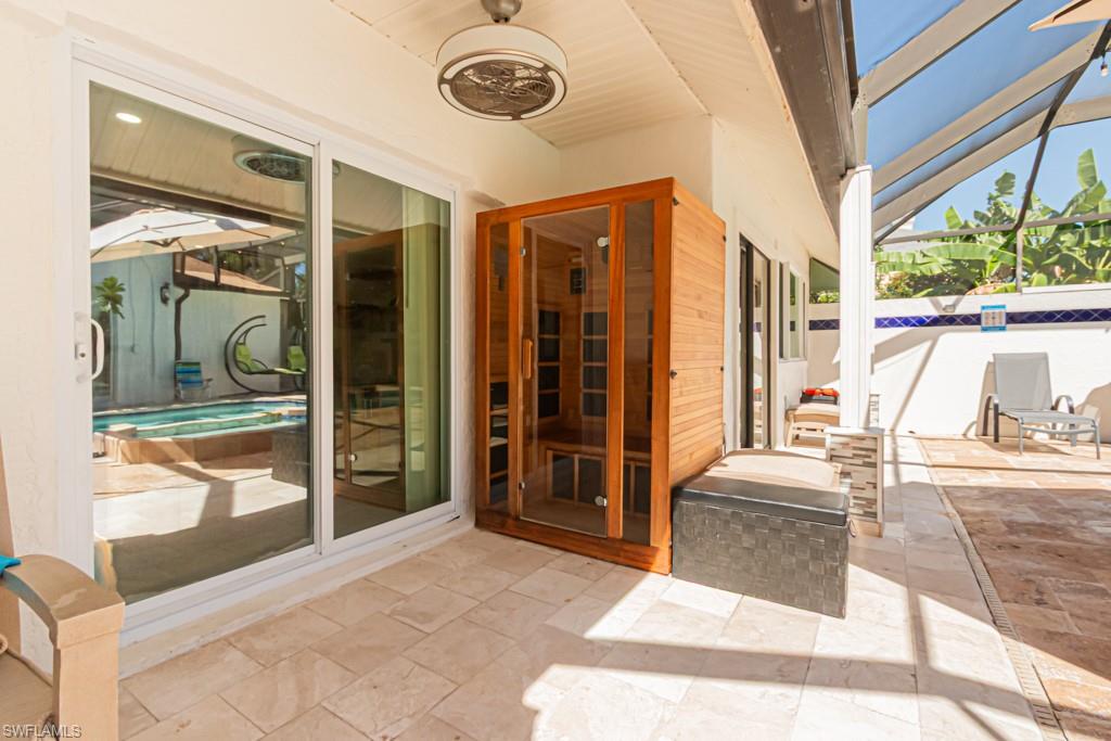 740 31st Street Southwest Naples, FL 34117 - Photo 14 of 50 a bedroom with a bed and a large window