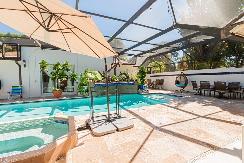 740 31st Street Southwest Naples, FL 34117 - Photo 16 of 50 a view of a backyard with sitting area