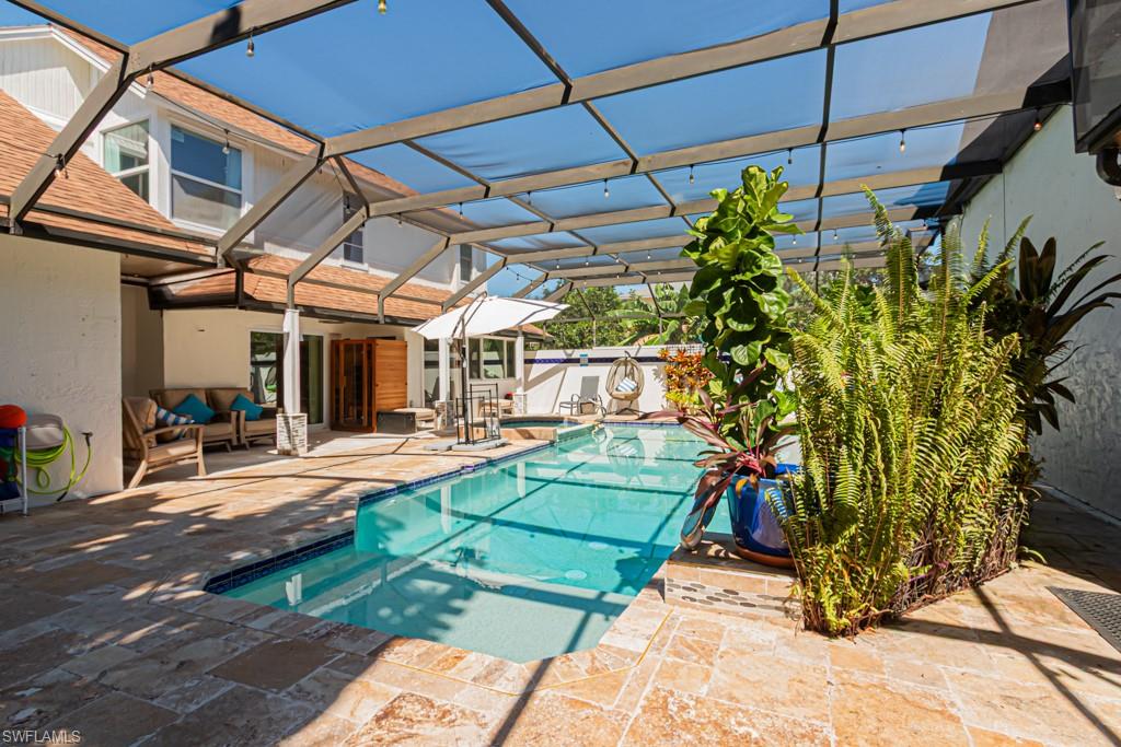 740 31st Street Southwest Naples, FL 34117 - Photo 19 of 50 a view of a chairs and table in the patio