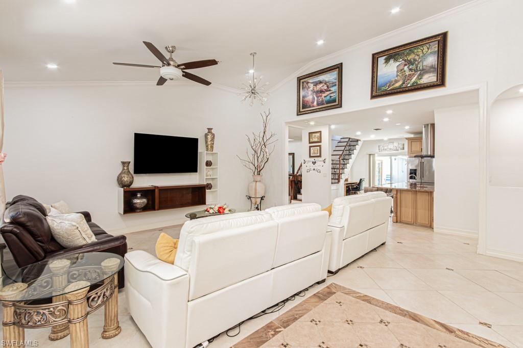 740 31st Street Southwest Naples, FL 34117 - Photo 23 of 50 a living room with furniture and a flat screen tv