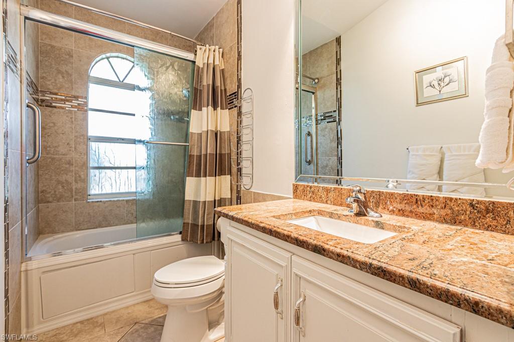 740 31st Street Southwest Naples, FL 34117 - Photo 36 of 50 a bathroom with a granite countertop sink toilet and shower