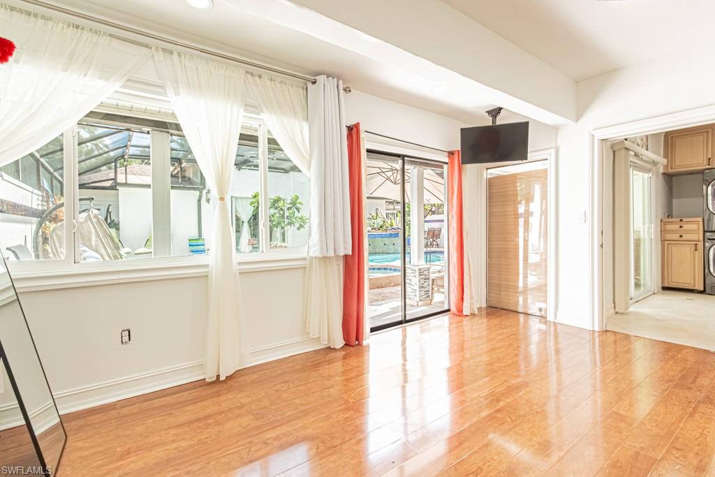 740 31st Street Southwest Naples, FL 34117 - Photo 38 of 50 a view of an empty room with a window and wooden floor