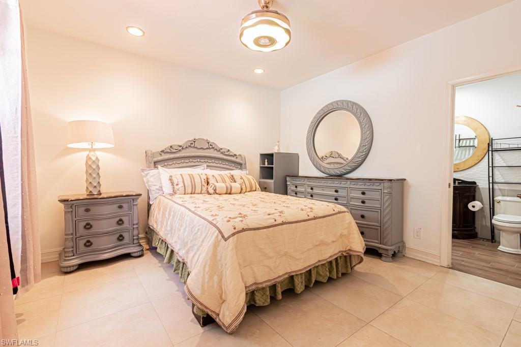 740 31st Street Southwest Naples, FL 34117 - Photo 46 of 50 a bedroom with a bed and a closet