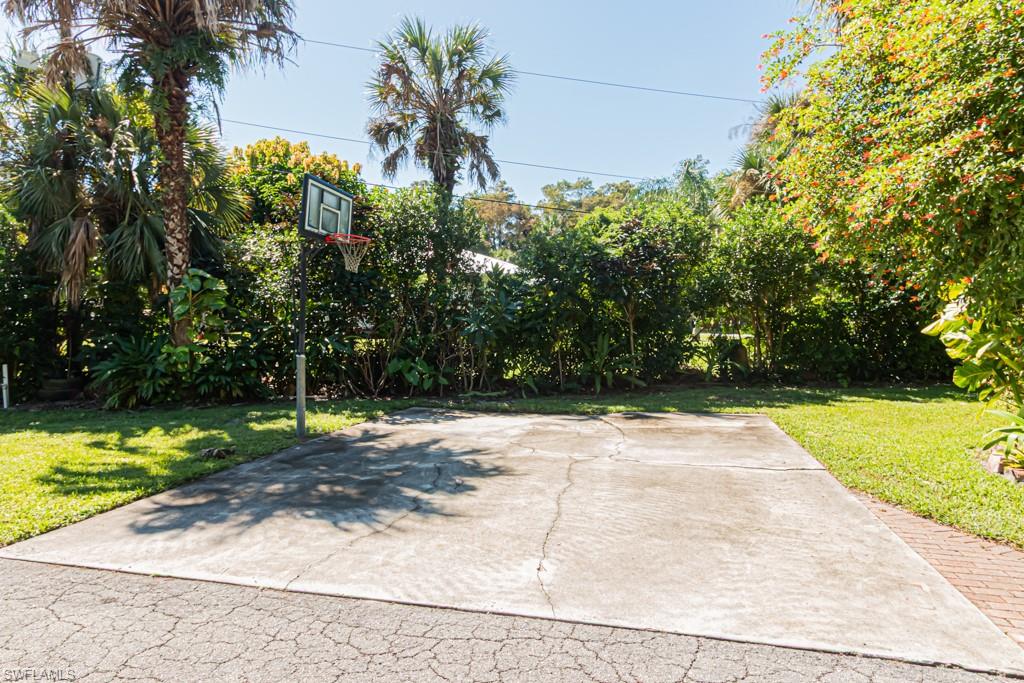 740 31st Street Southwest Naples, FL 34117 - Photo 5 of 50 a view of a yard with plants and large trees