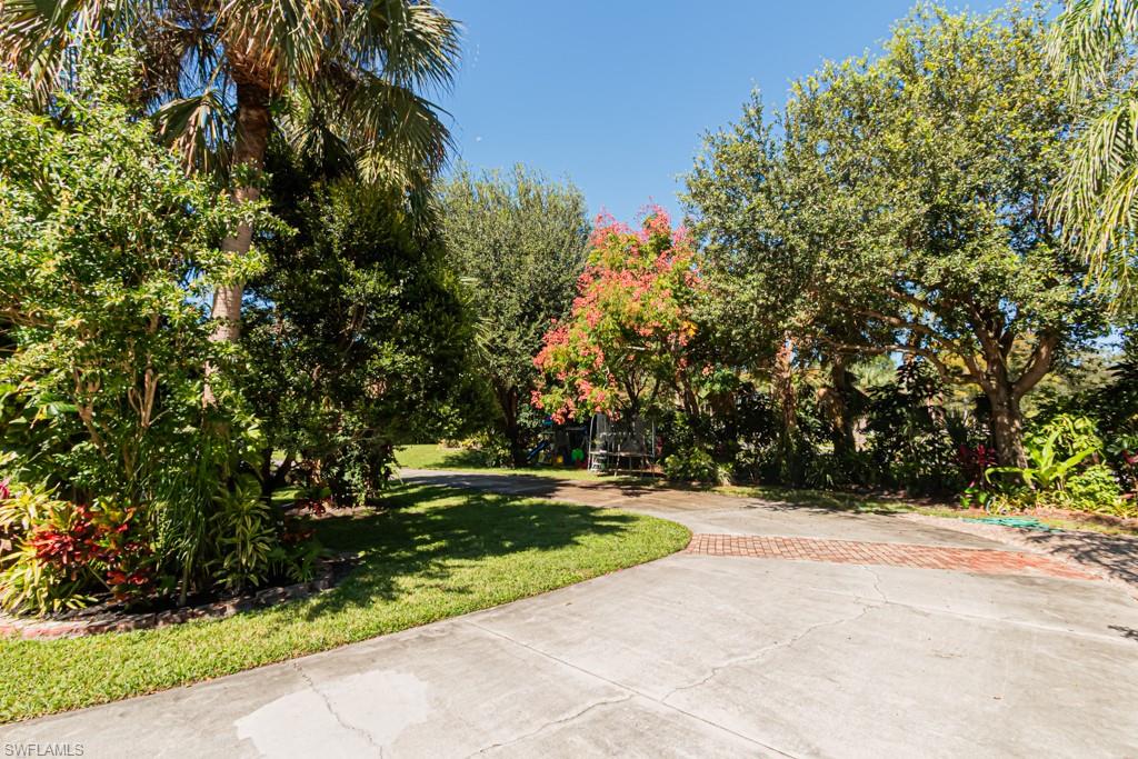 740 31st Street Southwest Naples, FL 34117 - Photo 6 of 50 a view of outdoor space with garden