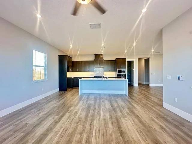 a kitchen with sink and cabinets