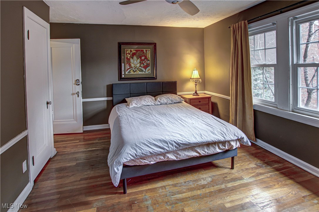 17800 Winslow Road Beachwood, OH 44122 - Photo 17 of 31 Bedroom featuring ceiling fan, wood-type flooring, and a textured ceiling