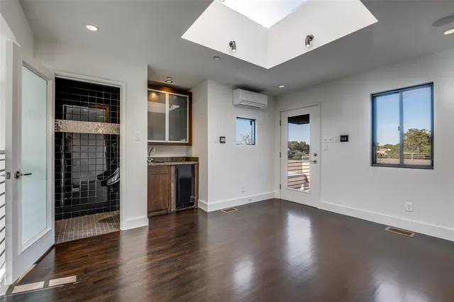 a view of an empty room with a ceiling fan
