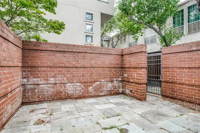a balcony view with couple of large trees