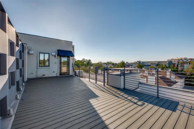 a view of a balcony with wooden floor