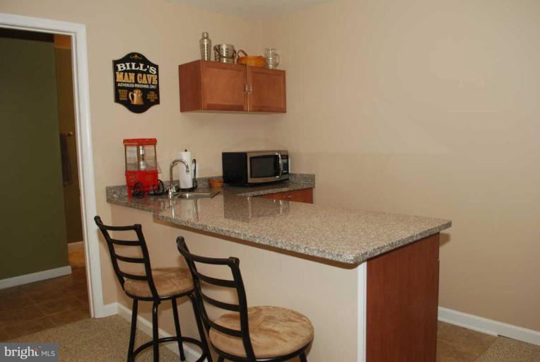 3845 West Chapel Road Aberdeen, MD 21001 - Photo 27 of 28 Finished lower level with granite counter top bar.