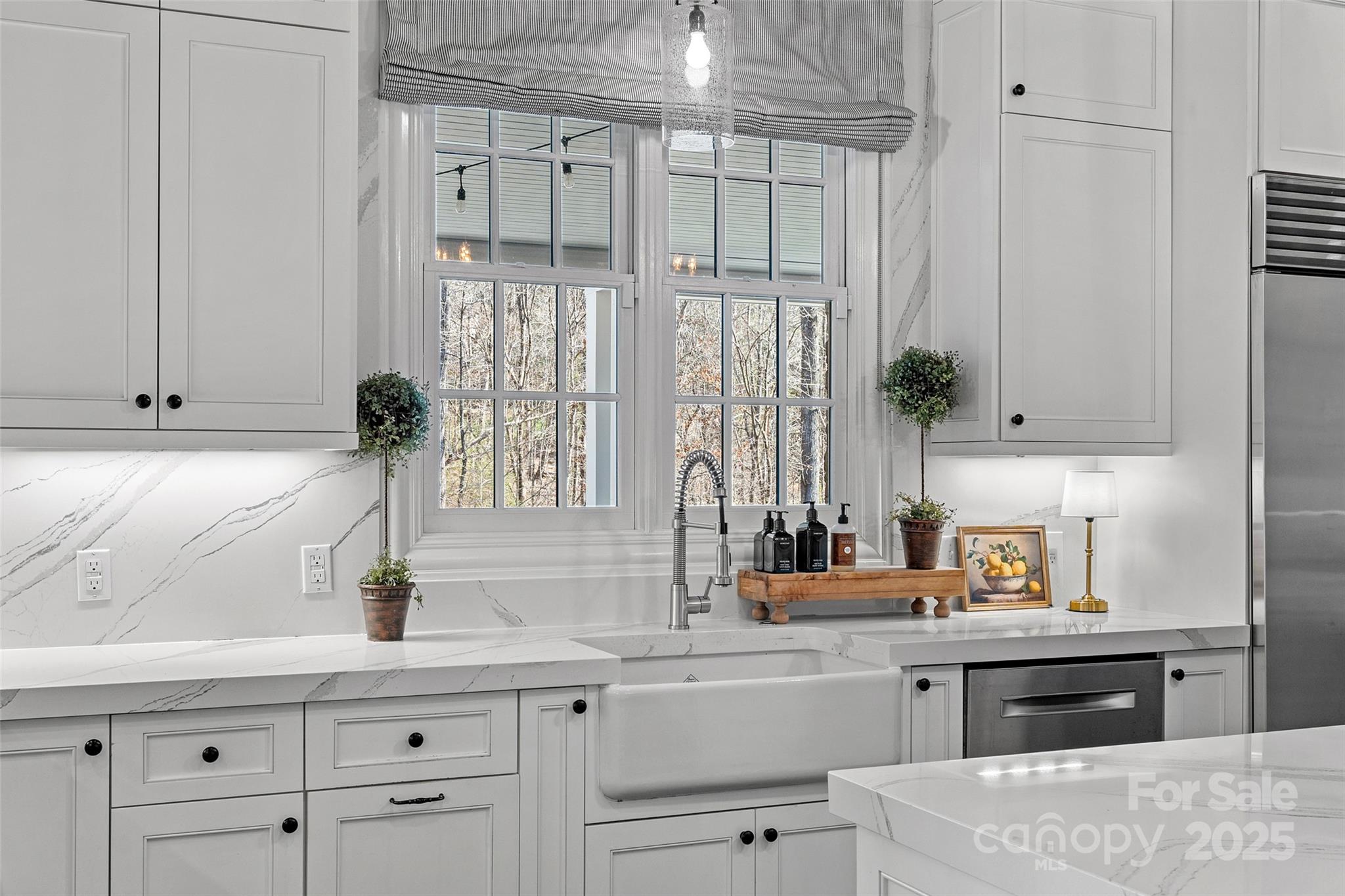 3212 Lazy Branch Road Charlotte, NC 28270 - Photo 15 of 47 a kitchen with a sink cabinets and window