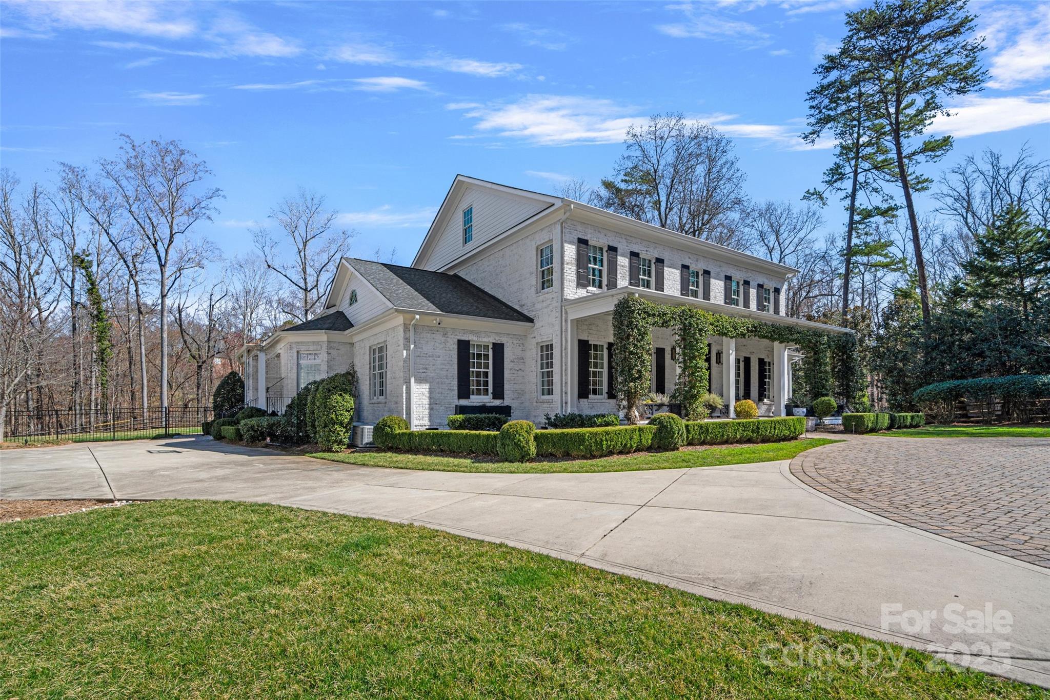 3212 Lazy Branch Road Charlotte, NC 28270 - Photo 3 of 47 a view of a white house with a yard and plants