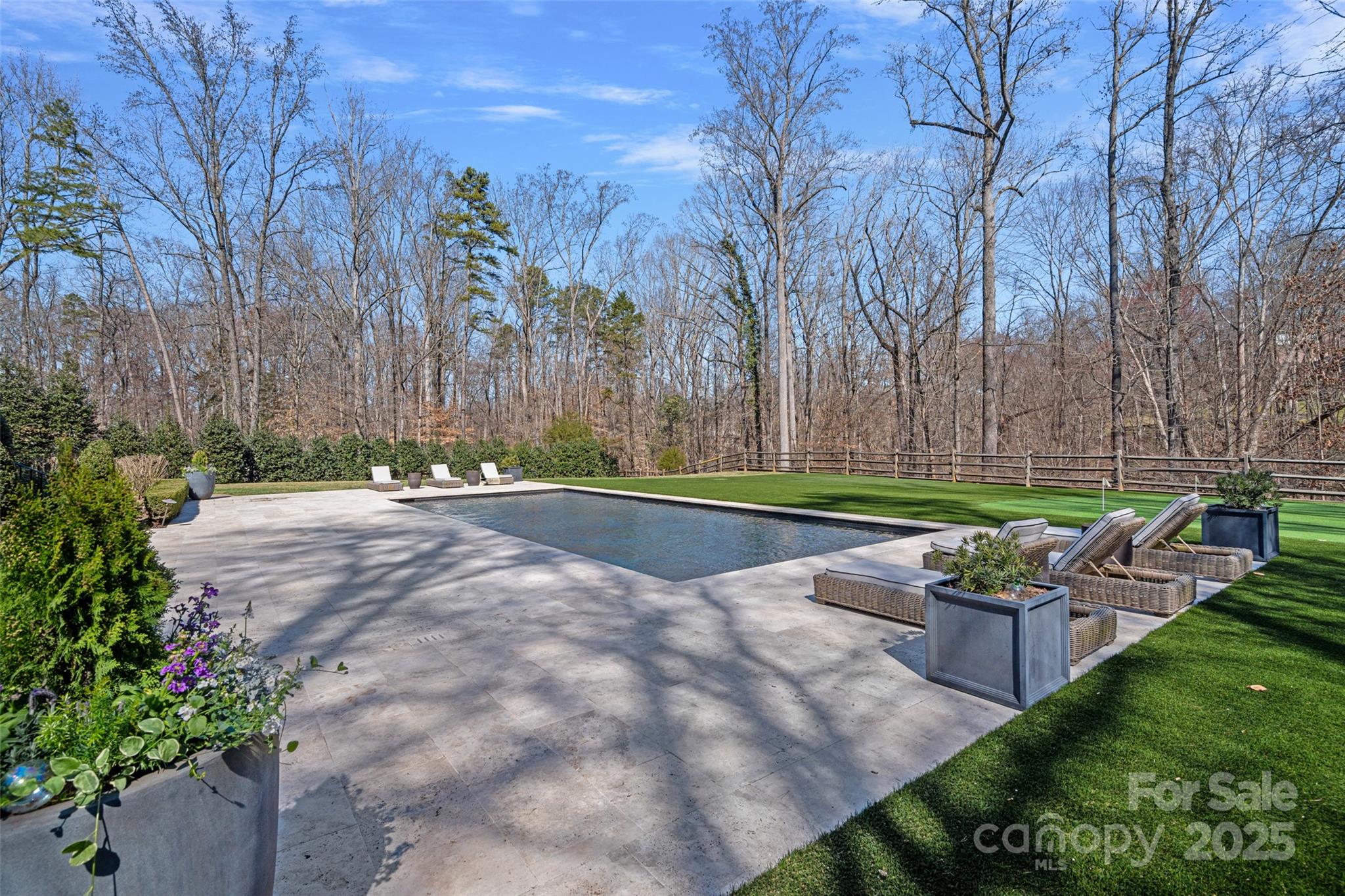 3212 Lazy Branch Road Charlotte, NC 28270 - Photo 43 of 47 a backyard of a house with table and chairs