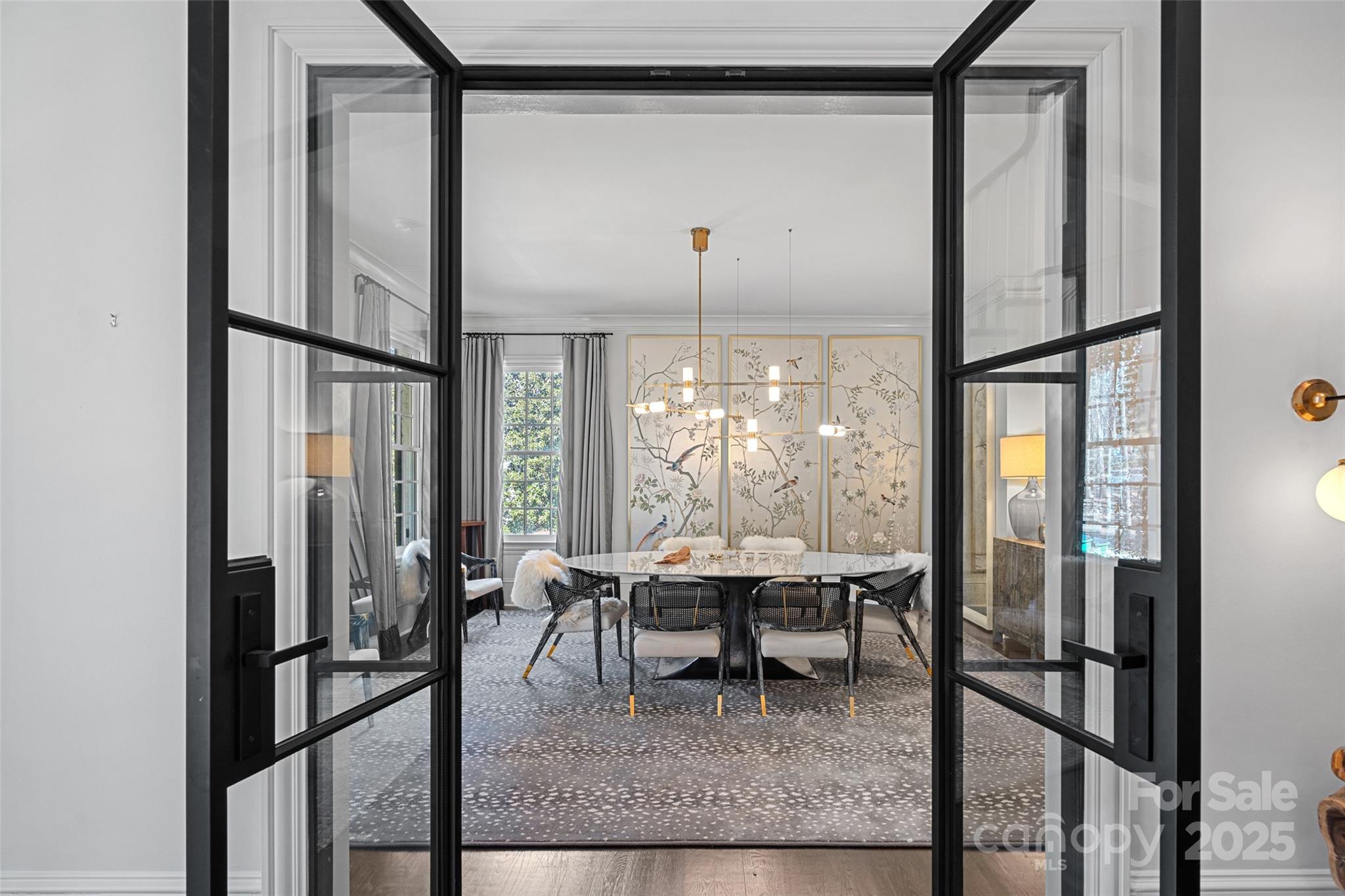 3212 Lazy Branch Road Charlotte, NC 28270 - Photo 10 of 47 a dining room with furniture a chandelier and wooden floor