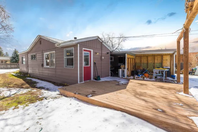 a view of a house with snow on the background
