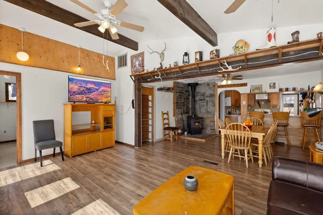 a view of a dining room with furniture wooden floor and chandelier