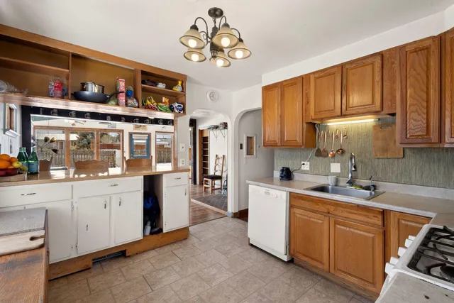 a kitchen with cabinets a sink and appliances
