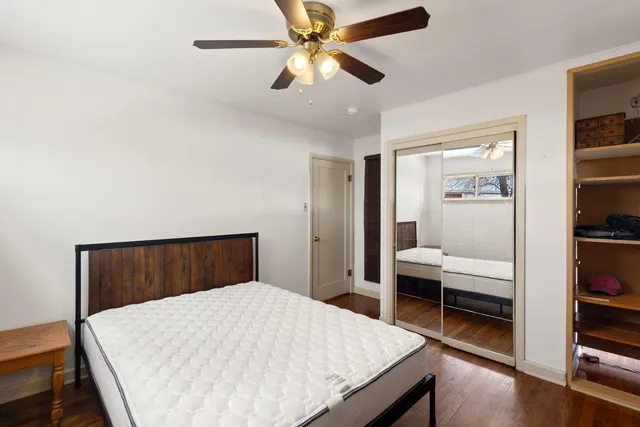 a bedroom with a bed and a bookshelf