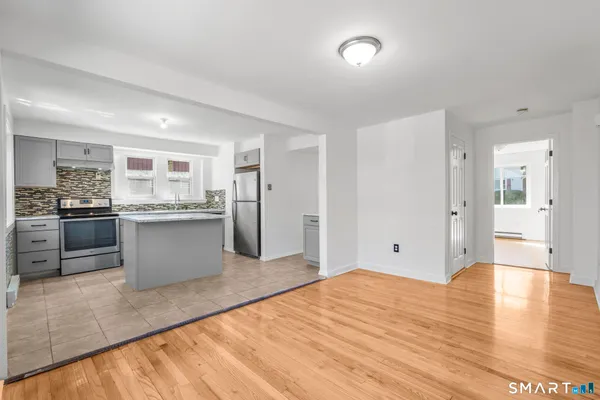 a view of kitchen with wooden floor
