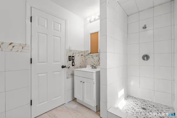a spacious bathroom with a shower