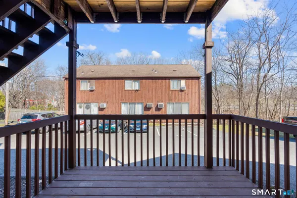 a view of a porch with wooden floor