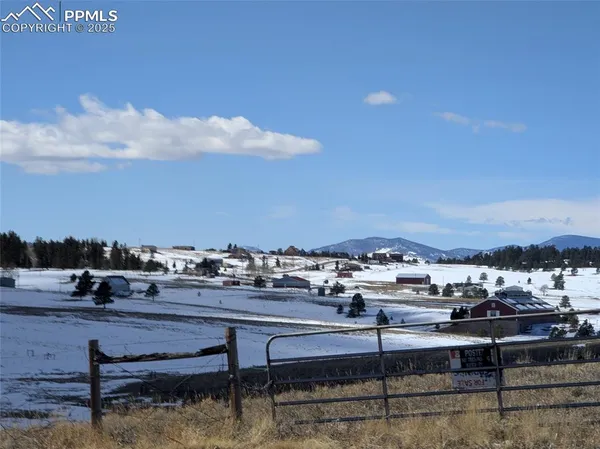 a view of swimming pool with outdoor seating