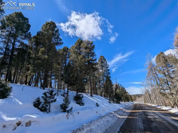 a view of backyard with sitting area