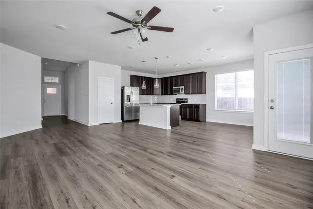 a view of kitchen with cabinets and wooden floor