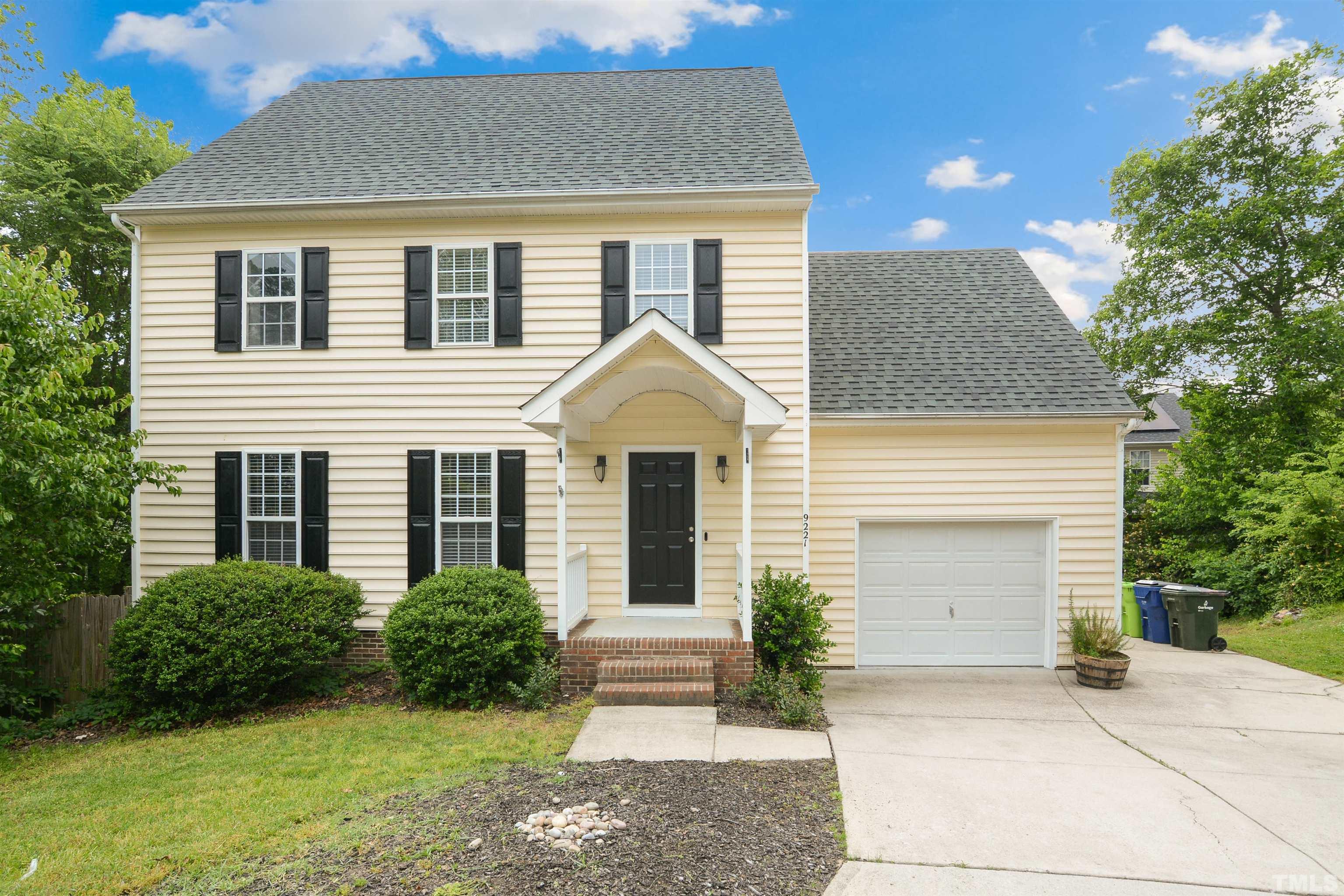 9221 Pennythorne Court Raleigh, NC 27615 - Photo 1 of 23 a front view of a house with garden