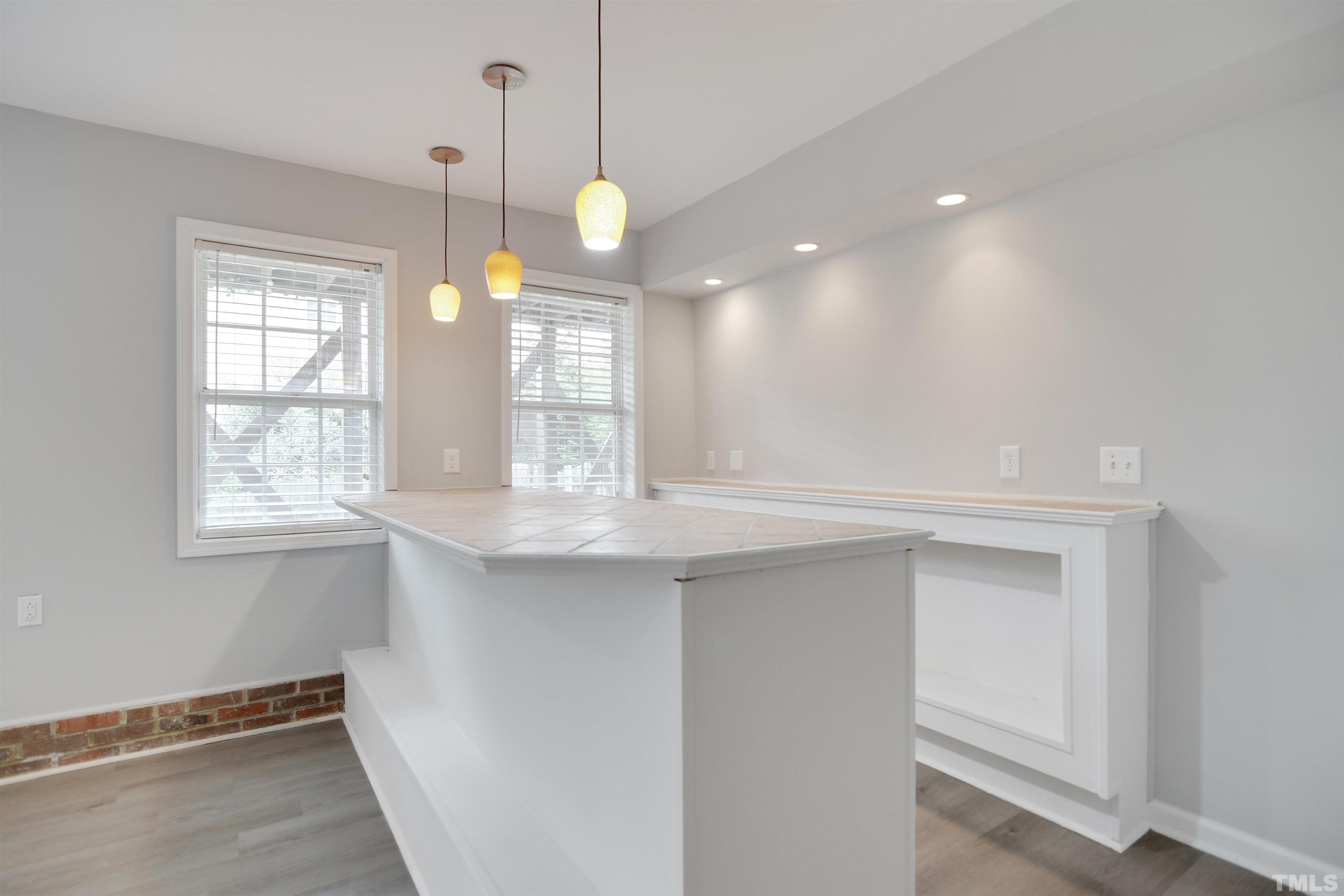 9221 Pennythorne Court Raleigh, NC 27615 - Photo 18 of 23 a view of a kitchen with a dishwasher and a window