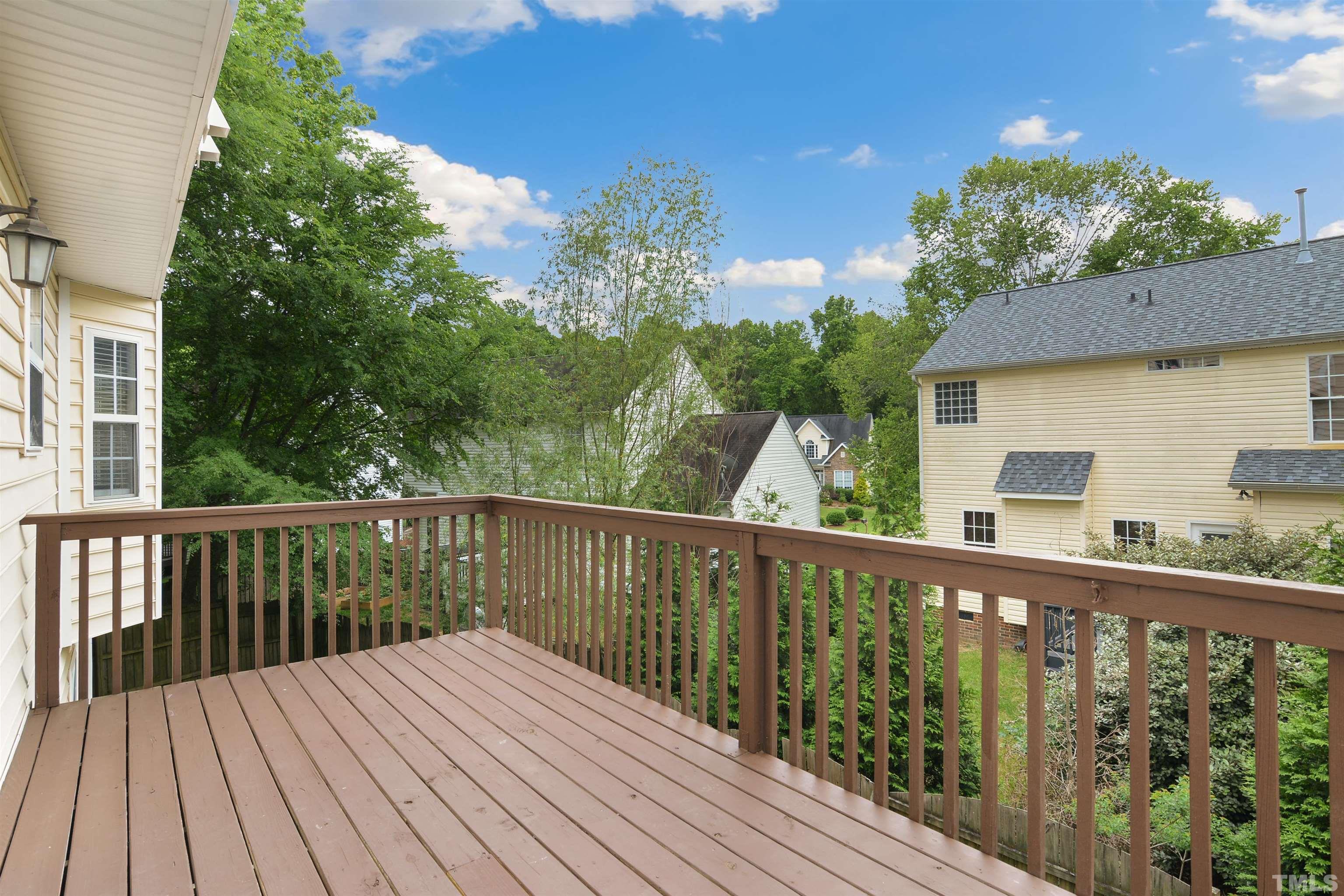 9221 Pennythorne Court Raleigh, NC 27615 - Photo 20 of 23 a view of balcony with wooden floor and fence