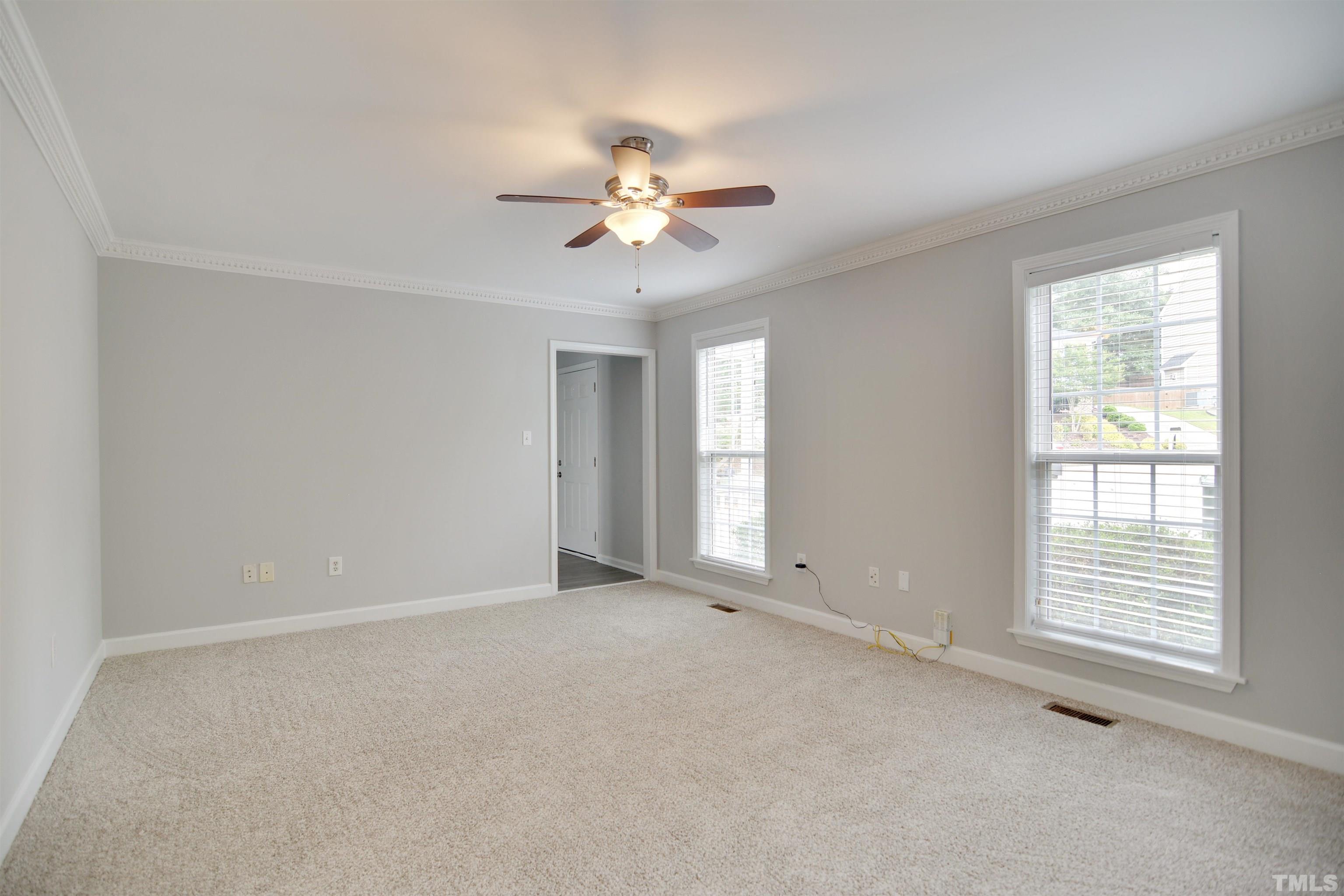 9221 Pennythorne Court Raleigh, NC 27615 - Photo 3 of 23 a view of an empty room with a window