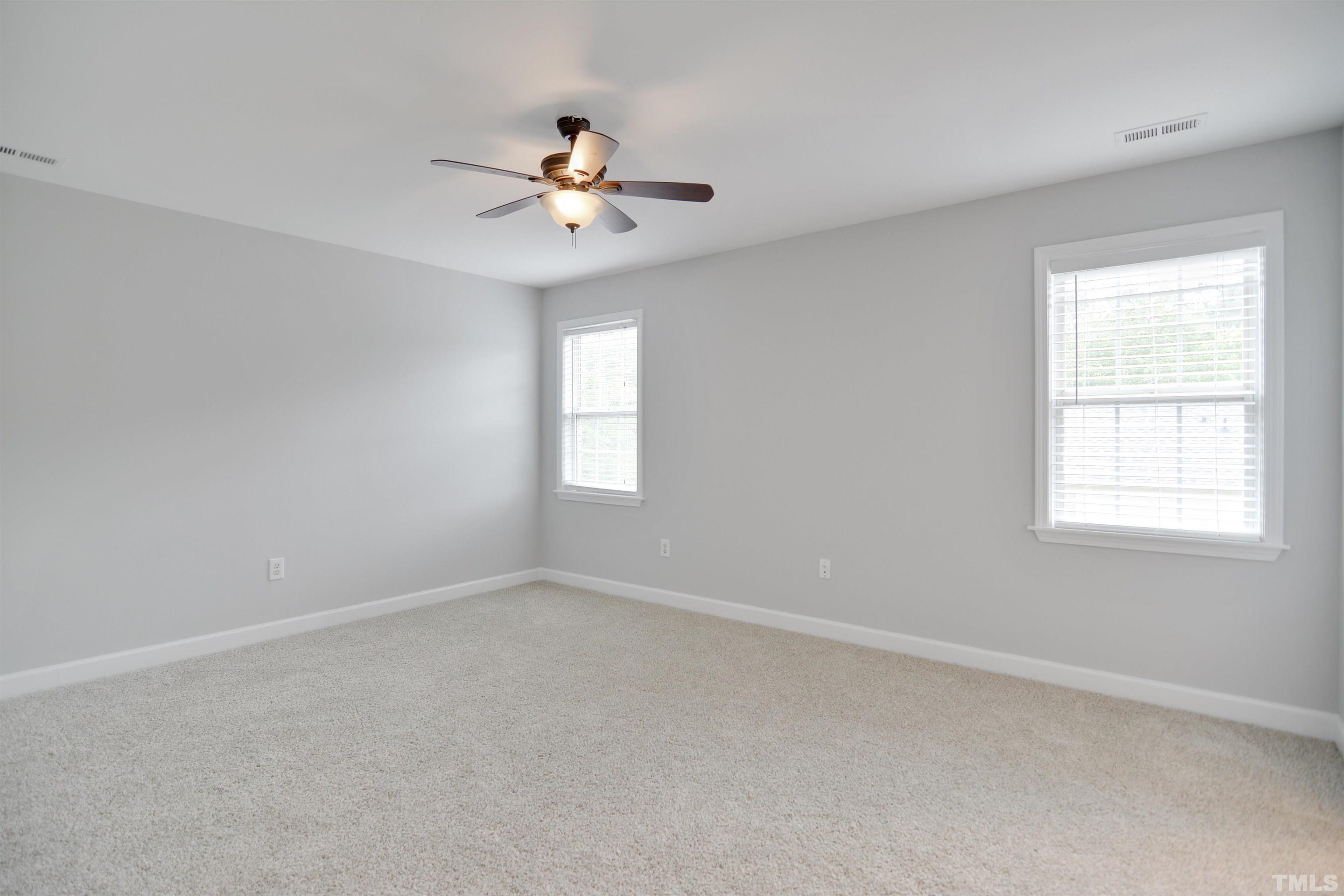 9221 Pennythorne Court Raleigh, NC 27615 - Photo 7 of 23 a view of an empty room with a window