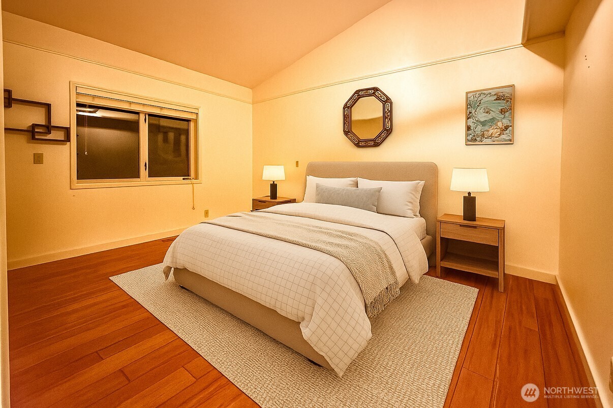 266 Quillayute Place La Conner, WA 98257 - Photo 11 of 17 a bedroom with a bed and a night stand