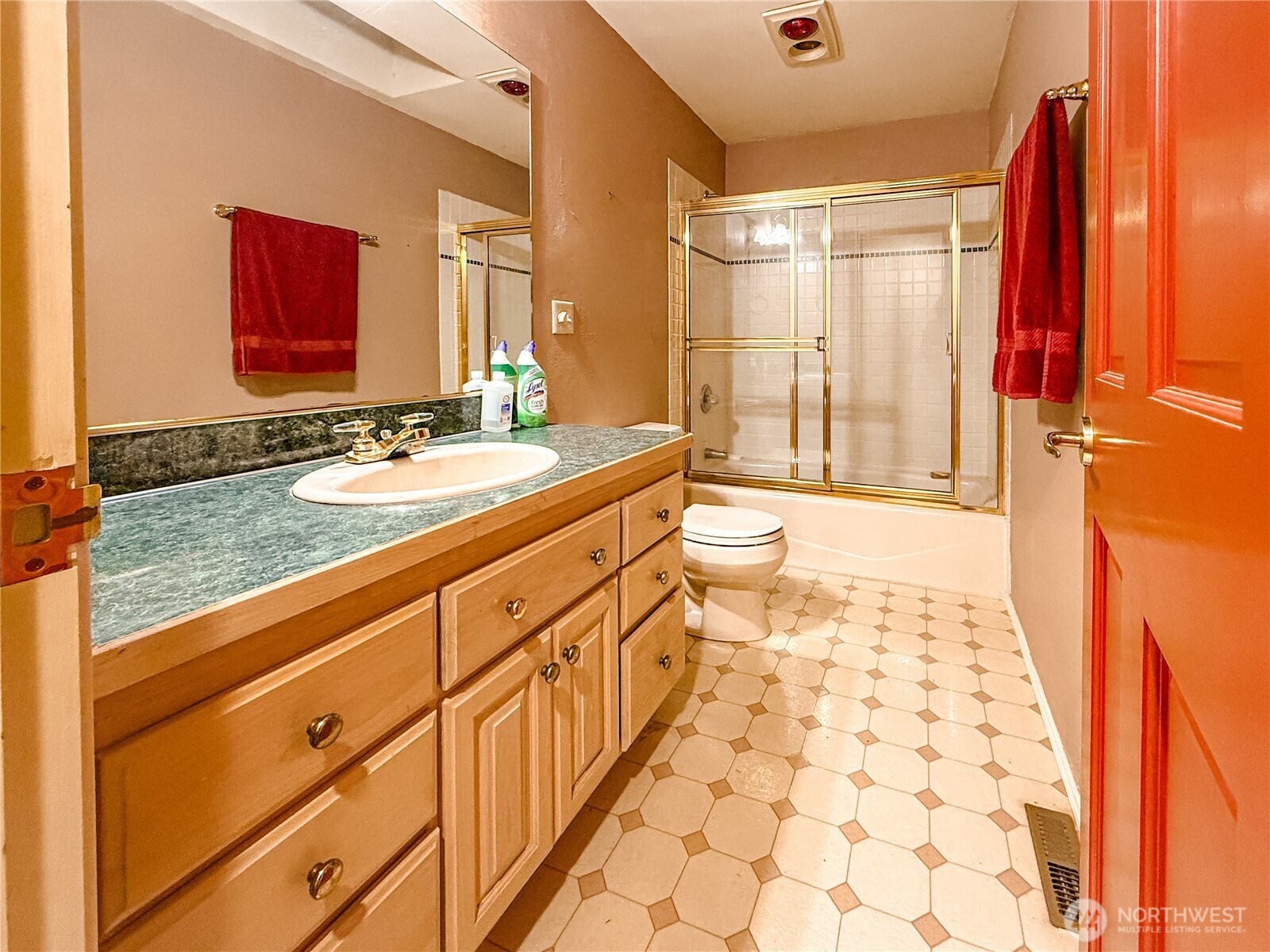 266 Quillayute Place La Conner, WA 98257 - Photo 12 of 17 a bathroom with a sink a toilet a mirror and shower