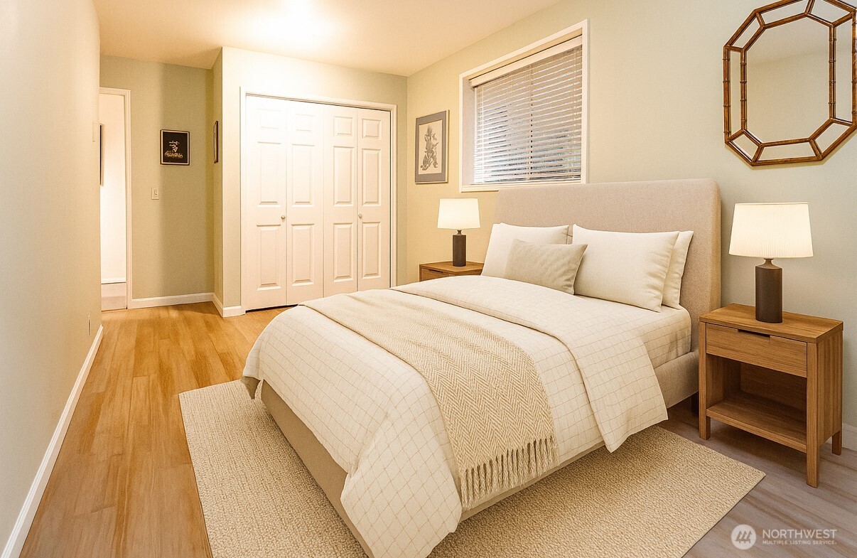 266 Quillayute Place La Conner, WA 98257 - Photo 14 of 17 a spacious bedroom with a bed and a window