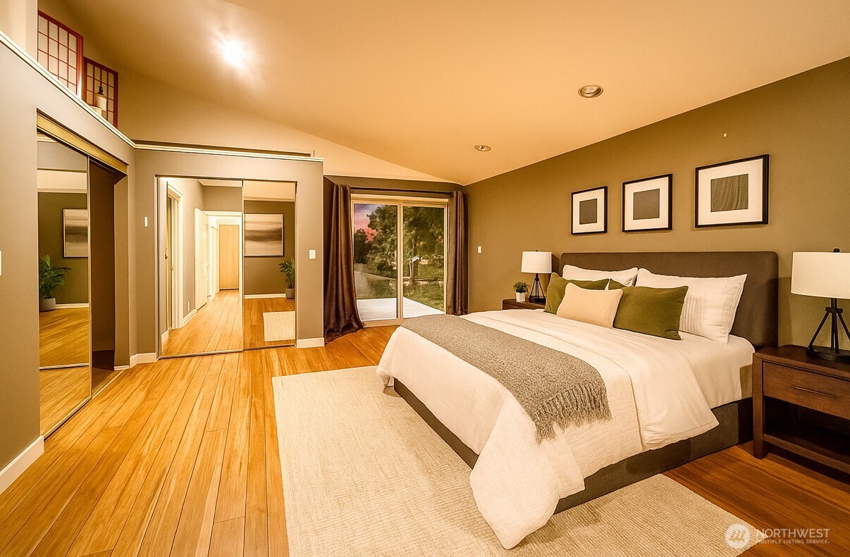 266 Quillayute Place La Conner, WA 98257 - Photo 7 of 17 a spacious bedroom with a bed and wooden floor