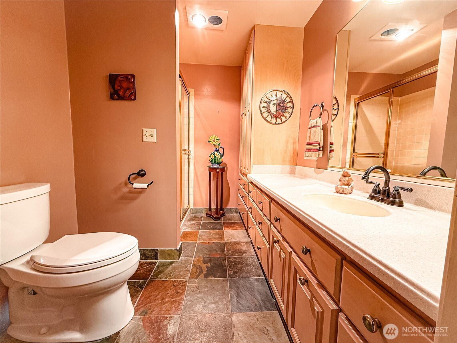 266 Quillayute Place La Conner, WA 98257 - Photo 9 of 17 a spacious bathroom with a sink a toilet a mirror and shower