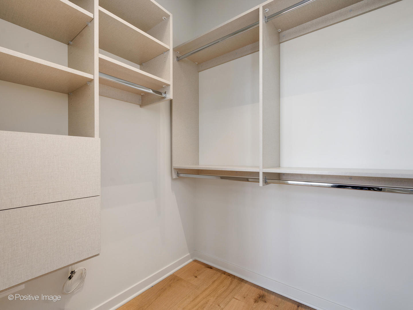 11 West Prospect Avenue, Unit 316 Mount Prospect, IL 60056 - Photo 11 of 72 a view of a room with racks on the wall