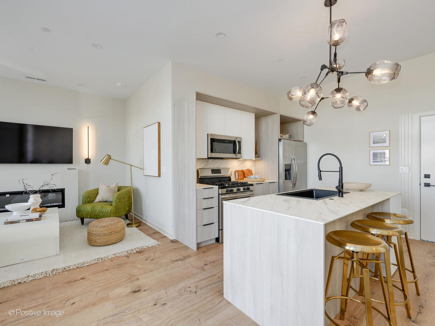 11 West Prospect Avenue, Unit 316 Mount Prospect, IL 60056 - Photo 6 of 72 a kitchen with stainless steel appliances granite countertop a stove top oven a sink dishwasher and a microwave with wooden floor