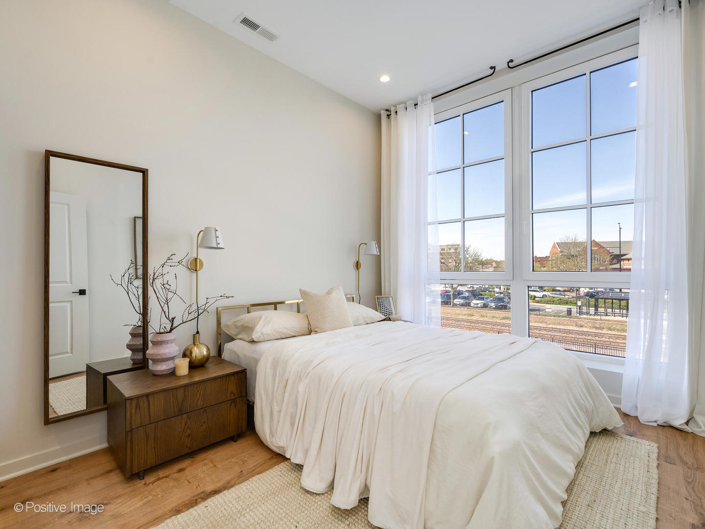 11 West Prospect Avenue, Unit 316 Mount Prospect, IL 60056 - Photo 9 of 72 a bedroom with a bed and a window