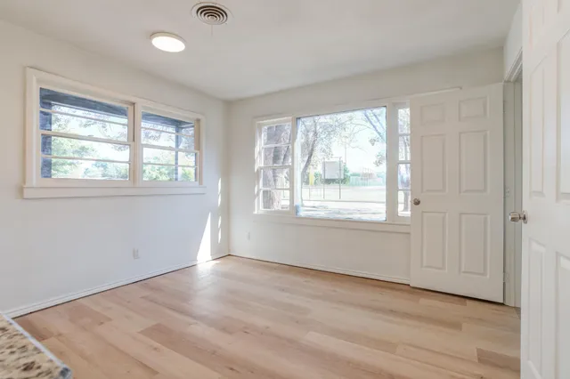 a view of an empty room with a window