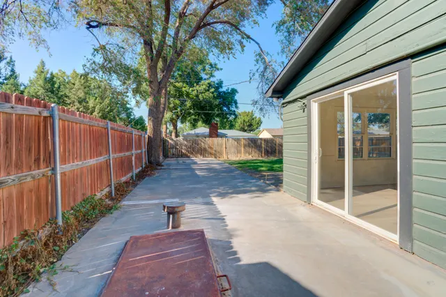 a front view of a house with seating space