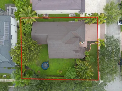 an aerial view of multiple houses with yard