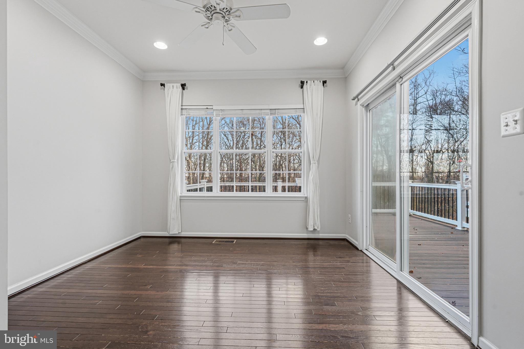 617 English Ivy Way Aberdeen, MD 21001 - Photo 13 of 35 a view of an empty room with wooden floor and a window