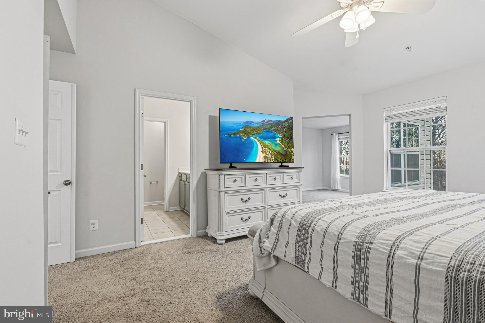 617 English Ivy Way Aberdeen, MD 21001 - Photo 16 of 35 a bedroom with a bed dresser and a flat tv screen