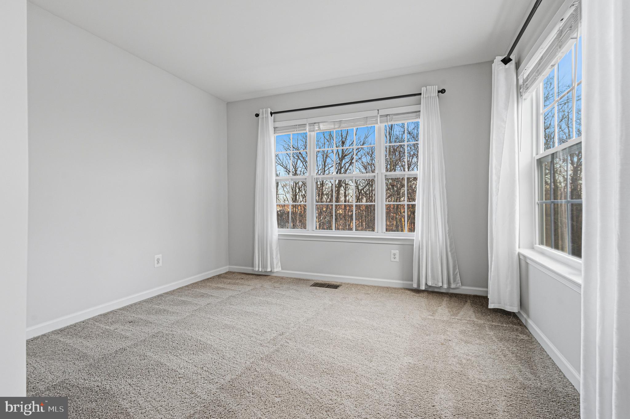 617 English Ivy Way Aberdeen, MD 21001 - Photo 18 of 35 a view of an empty room with a window