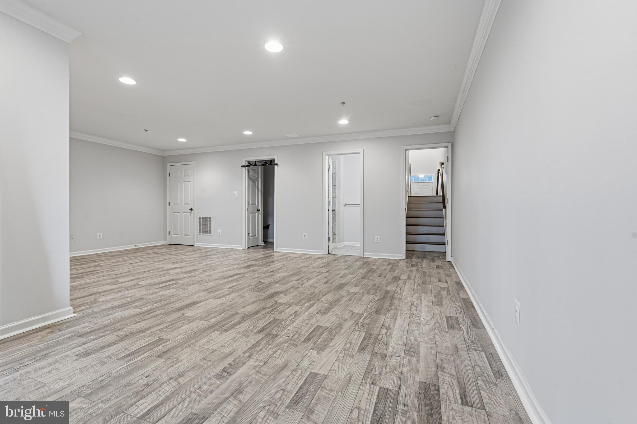 617 English Ivy Way Aberdeen, MD 21001 - Photo 24 of 35 a view of an empty room with wooden floor