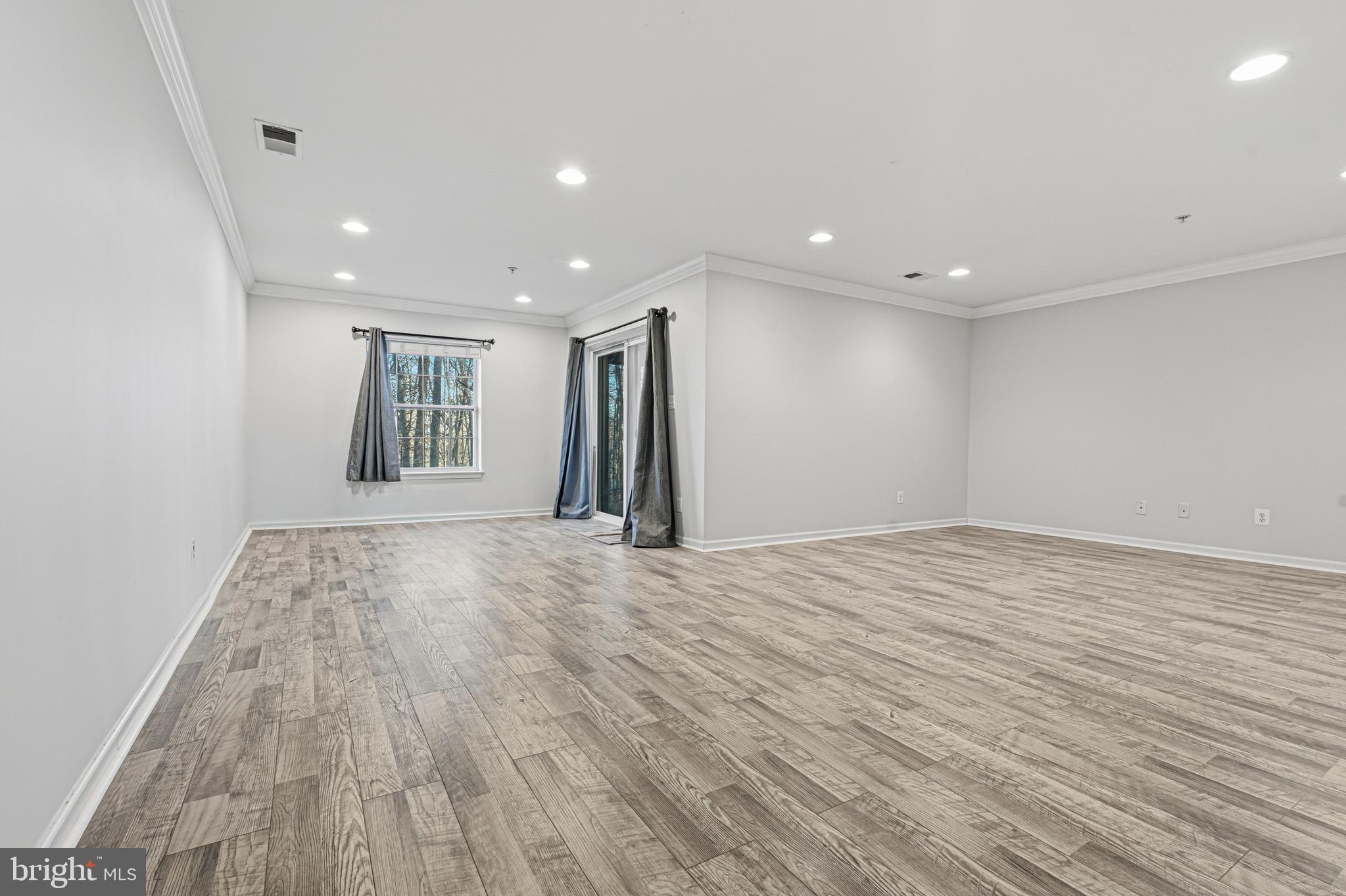 617 English Ivy Way Aberdeen, MD 21001 - Photo 25 of 35 a view of empty room with wooden floor and fan